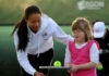 Sports stars coach Down’s tennis team Anne Keothavong with a member of Fulham's Down's syndrome tennis team