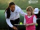 Sports stars coach Down’s tennis team Anne Keothavong with a member of Fulham's Down's syndrome tennis team