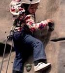 Ruby tackles a climbing wall.