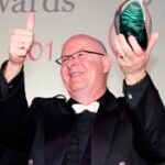 Clark Denmark collects his 2011 Joseph Maitland Robinson Award for Outstanding Contribution.