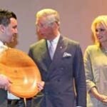 Graeme Croton is presented with his award by HRH the Prince of Wales and Joanna Lumley.