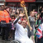 Gobi with the Olympic flame in Stevenage in July 2012.