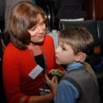 Actress Rebecca Front with seven-year-old Sam Cowell, who was born deafblind.