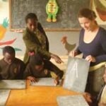 VSO volunteer Jo Keenahan models a literacy session.
