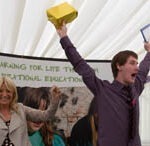 A 2012 winner, Luke Tuckwell, receives his award from Gaby Roslin.