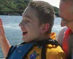 James and his dad enjoy a family day out on the water at Salcombe.