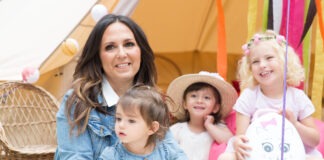 Potty Training with SEN Potty Training teacher Amanda Jenner sits on a floor, with three small children around her.