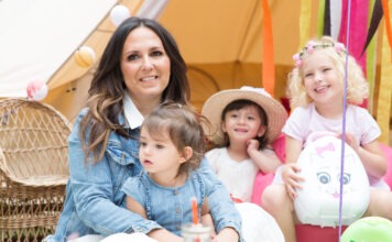 Potty Training with SEN Potty Training teacher Amanda Jenner sits on a floor, with three small children around her.