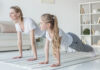 The Benefits of Yoga for SEND Pupils a woman and child doing yoga together wearing matching grey-white outfits
