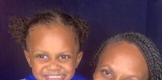Be the change in 2021 Venessa and her grandson, who is wearing a blue hoodie, with two buns on his head